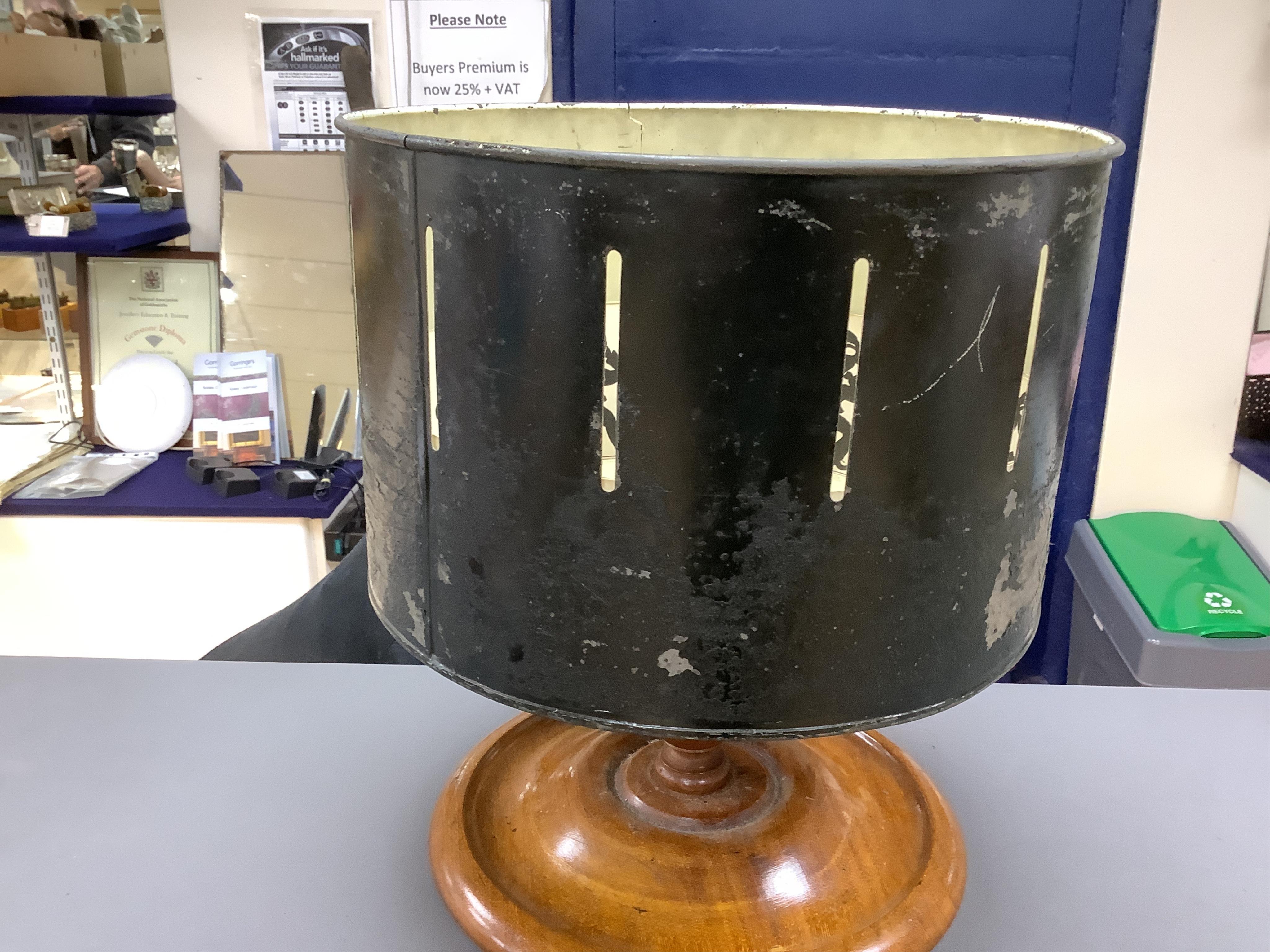 A late 19th century painted tin and mahogany zoetrope by the London Stereoscopic Co. with a number of paper inserts, diameter 30cm